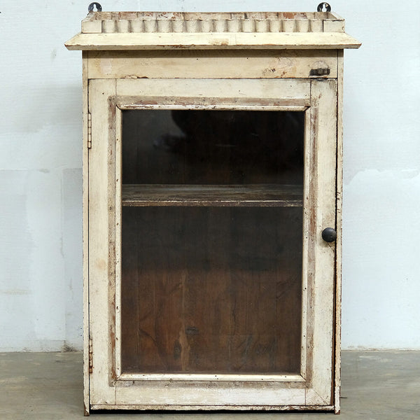 Cream-colored old wall cabinet